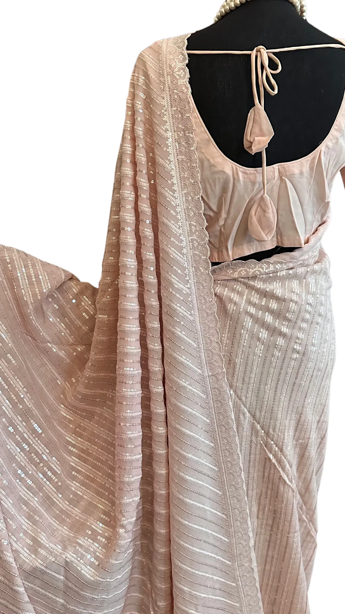 Pastel pink Sequin crepe saree with prestitched blouses